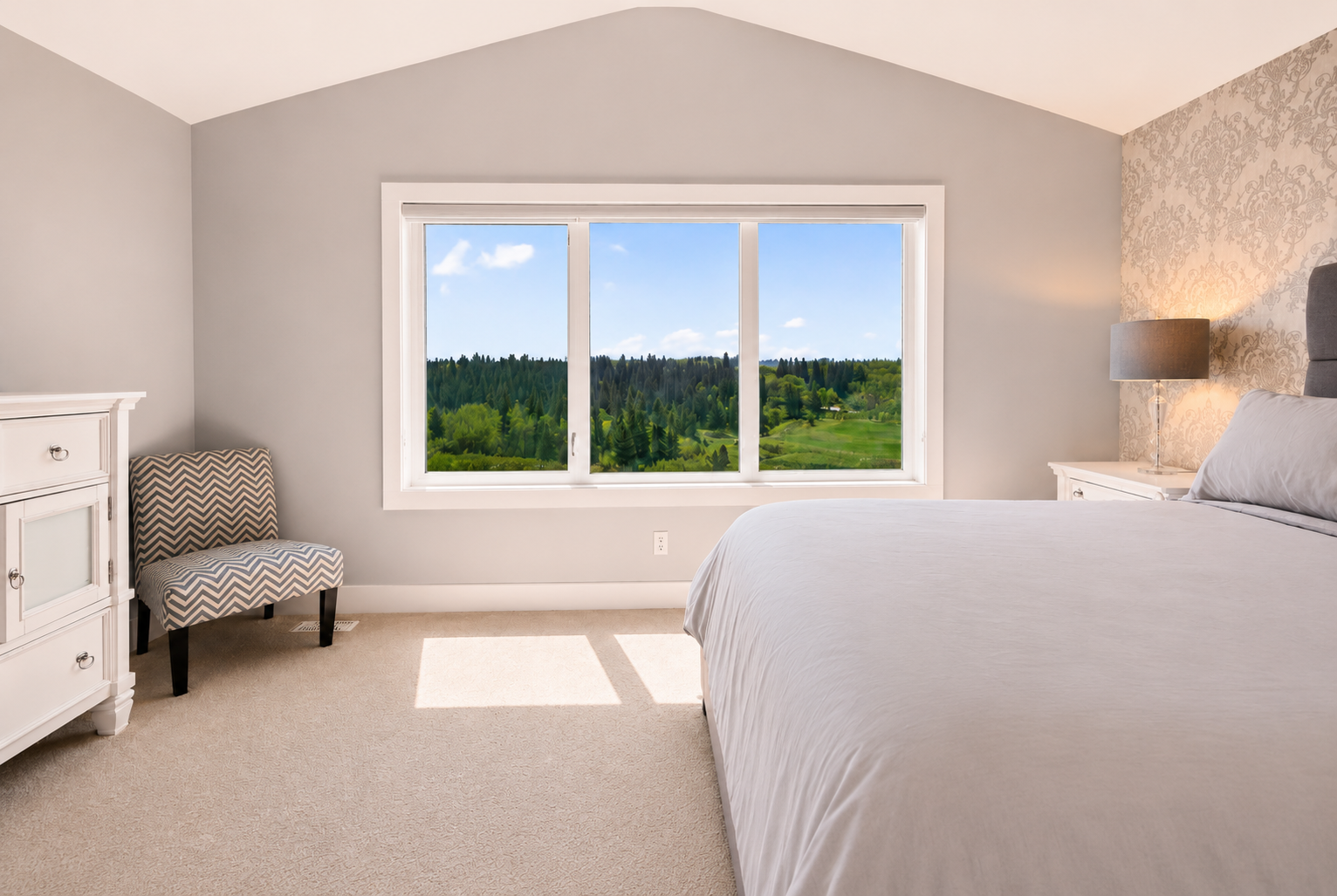 Secondary bedroom with chevron chair and ridge view