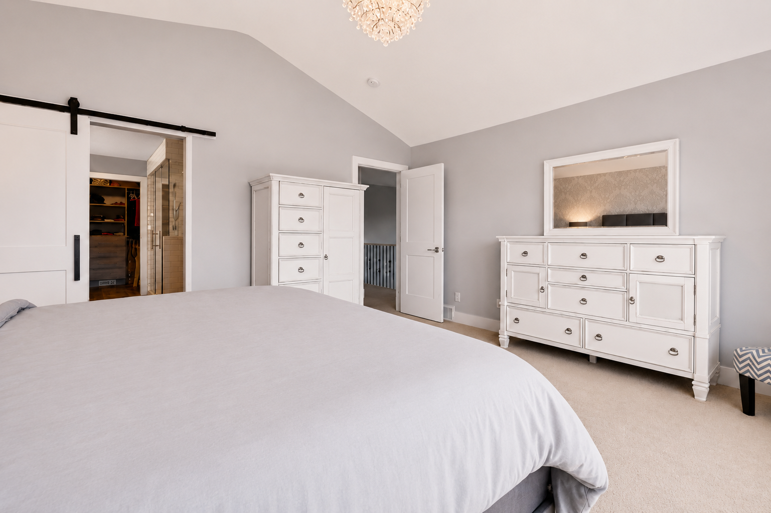 Primary bedroom toward closet and entry