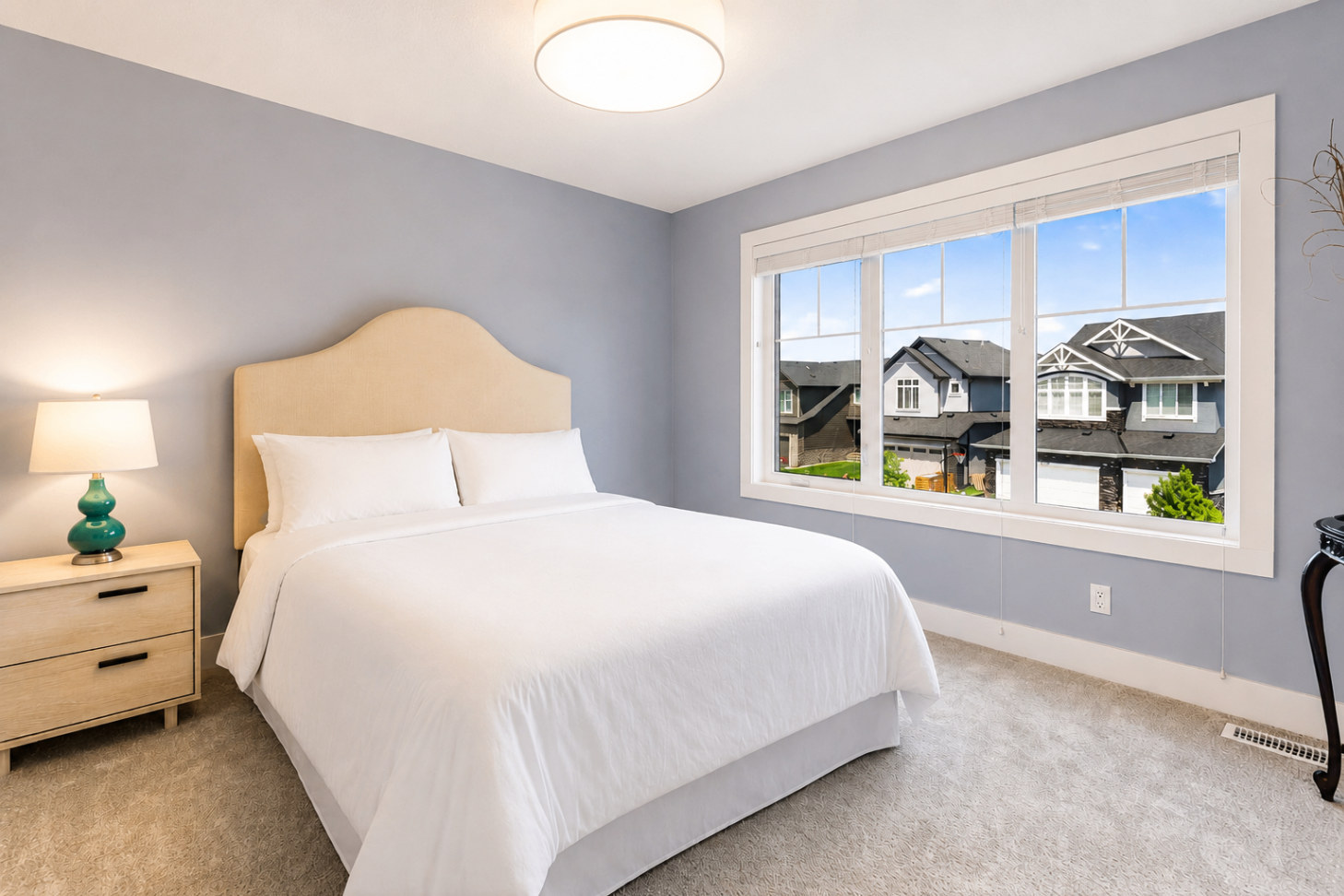 Secondary bedroom with cream headboard